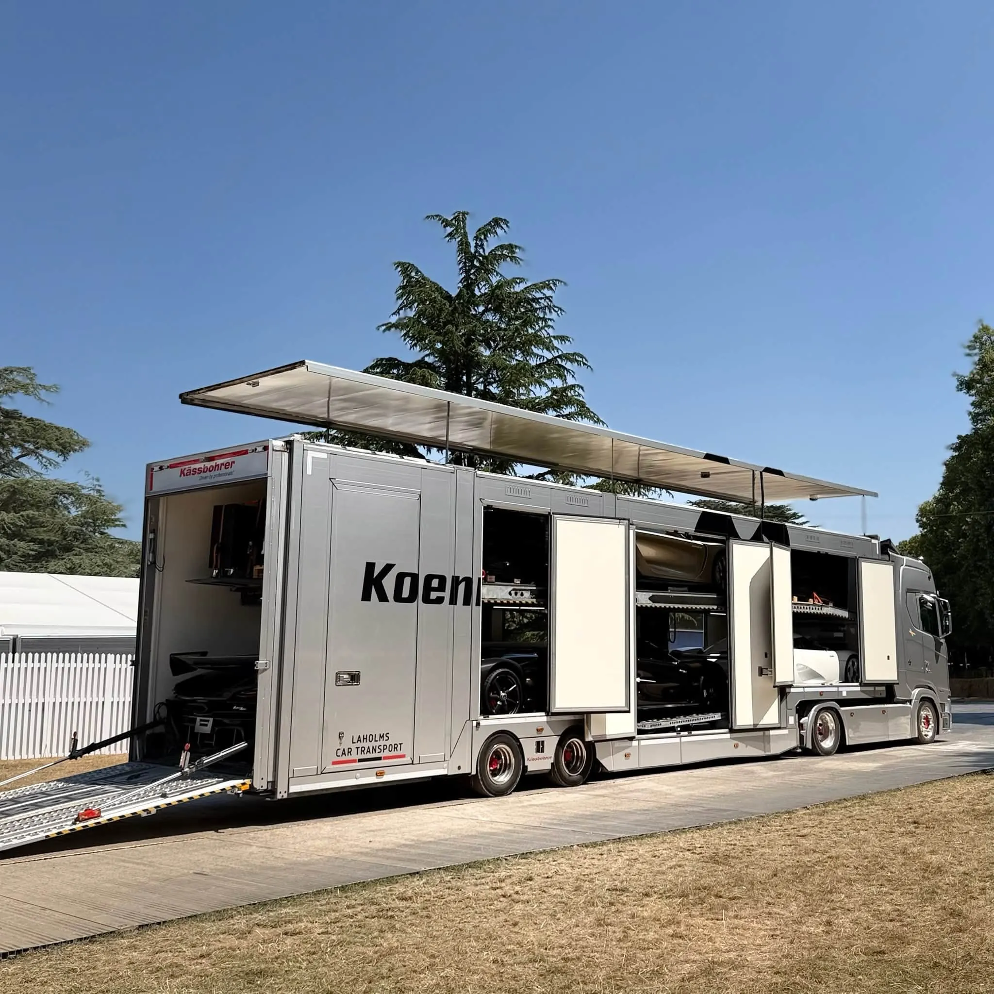 Trailer with Koenigsegg branding set up at an event